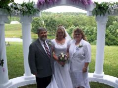 My daughter standing between me and her dad at her wedding last year.