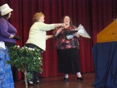 Winning the top award at the Women of achievement awards banquet on 10/11/08.  Full body shot.