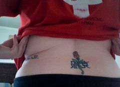 Got this done at Imperial Ink in Cincinnati, OH in 2002, I think.  Rose (my middle name, as well as my mom's, grandma's, great gma's, etc) with kanji symbols meaning "to overcome."  And the kanji was provided by a japanese exchange student my au