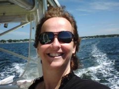 me on our boat wind in my hair