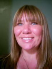 This was taken in the bathroom at a restaraunt.  It had awesome lighting.  Not too bad for a self portrait. :)